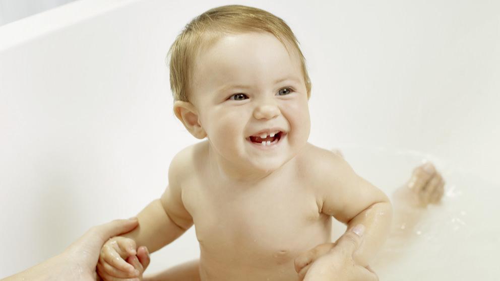 Baby enjoying bath - Weleda