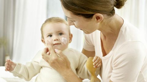 Applying Baby Face Cream - Weleda